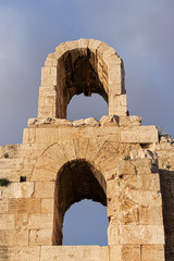 Picturesque view of Greek ruins of Odeon of Herodes Atticus (161AD) - stone Roman theater at the Acropolis hill on sunset. Athens, Greece.