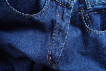 Jeans background. Denim jeans texture. Blue denim pattern.
