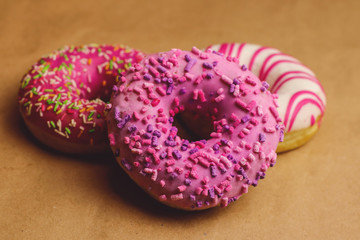Tasty donut on brown background