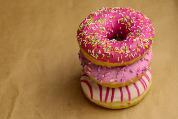 Tasty donut on brown background