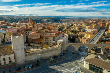 Aerial panoramic view of Teruel Spain with medieval city walls, viaduct, aquaduct and semi circular tower on a sunny winter afternoon 