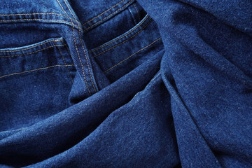 Jeans background. Denim jeans texture. Blue denim pattern.