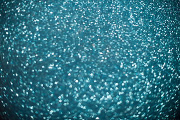 Color Bokeh on a dark background with hearts for use in graphic design. Abstract content. Valentines day.