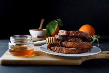 Torrijas with honey. Typical spanish dessert for Lent and Easter