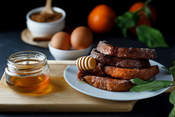 Torrijas with honey. Typical spanish dessert for Lent and Easter