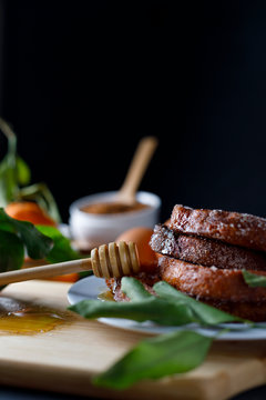 Torrijas with honey. Typical spanish dessert for Lent and Easter