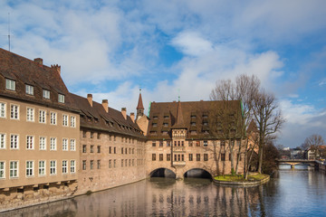 Fototapeta premium Bridge and Hospital, Holy Spirit hospice (Heilig-Geist-Spital) in Nuremberg, Bavaria, Germany