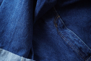 Jeans background. Denim jeans texture. Blue denim pattern.