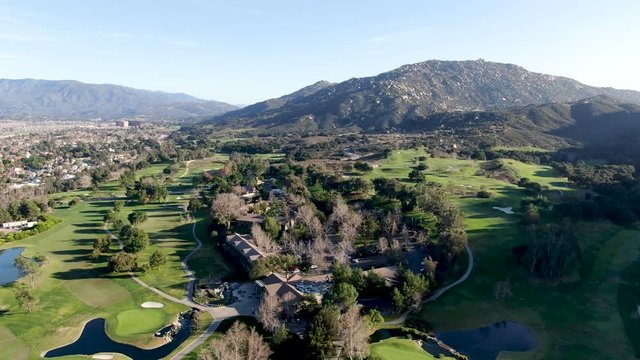 Aerial view of golf course with green field in the valley. Green turf scenery. Temecula, California, USA