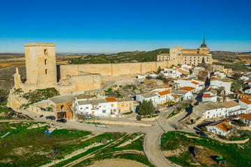 Fototapeta na wymiar Aerial sunny afternoon view of Ucles castle and monastery historic medieval walled town in Cuenca province Spain