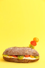 chicken breast sandwich with tomato on walnut bread