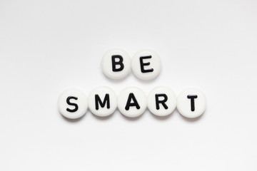 BE SMART written on white circles isolated on a white background...