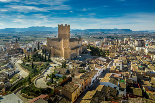 Aerial view of Atalaya castle over Villena Spain. The fortress has concentric plan, with a rectangular barbican forming space in front of the keep.  The external wall has chemin-de-ronde or wall-walk