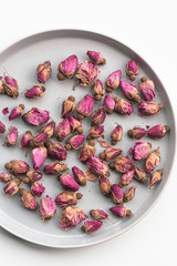 Directly above shot of dried rosebuds on plate