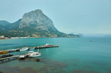 Mount Falcon and Green Bay in the New World. Boat pier. Republic of Crimea