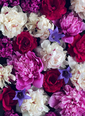 floral background with peonies and roses, top view.