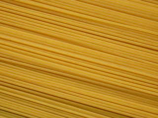 Raw dry spaghetti straight as background