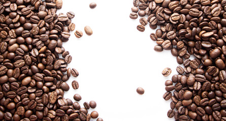 Coffee beans on a white background with place for text.