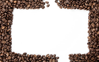 Coffee beans on a white background with place for text.