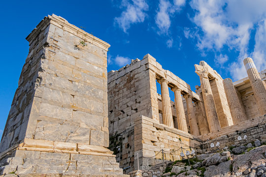 Ancient Greek ruins of Propylaea (gateway, 432 BC) on a top of Acropolis hill in Athens. Acropolis - main tourist attraction of Athens. Greece.