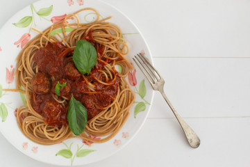 Whole grain spaghetti with complex carbohydrates on a white background. Healthy food.