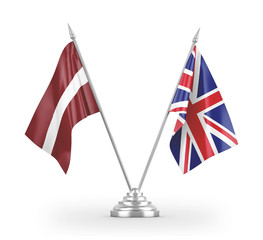 United Kingdom and Latvia table flags isolated on white 3D rendering