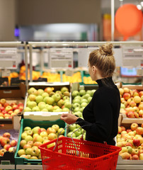 Woman buying fruits at the market	