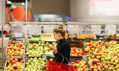 Woman buying fruits at the market	