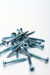 Steel wood screws isolated on a white background with space for copy