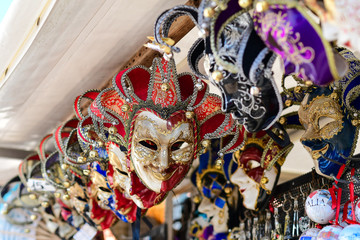 Carnival in Venice Italy. Traditional venetian carnival masks in the Italian market for tourists. trip to Italy, carnival 2020. selective focus.