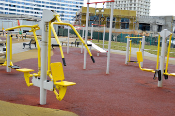 A new modern safe outdoor workout area with exercise equipment for sports in the new district of the city in the courtyard of the new building