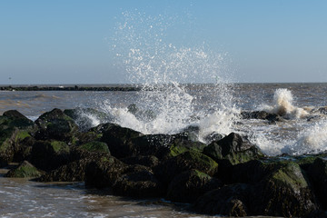 waves crashing on rocks