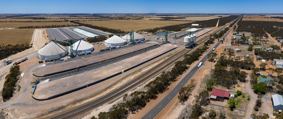 Aerial panoramic view of the small town of Grass Patch in Western Australia with the large grain silos located next to the Coolgardie-Esperance Highway