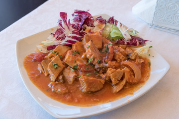Stew with tomato sauce and onion