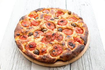 Focaccia typical of Bari Italy with tomatoes and olive