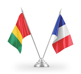 France and Guinea table flags isolated on white 3D rendering