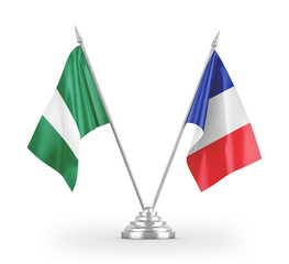 France and Nigeria table flags isolated on white 3D rendering