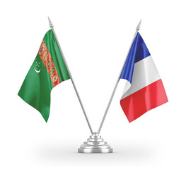 France and Turkmenistan table flags isolated on white 3D rendering