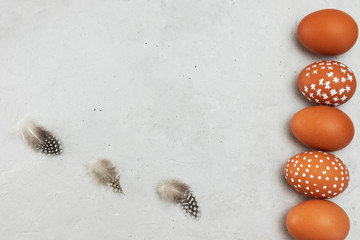 Background of five eggs and feathers greeting card for St. Easter holiday