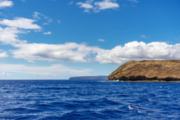 Fototapeta na wymiar Eastside of Molokini Crater with Kaho’olawe Island in the background in Maui, Hawaii