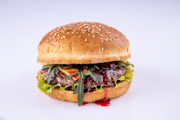  hamburger with cherry sauce on a light background for the menu