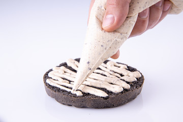  phased assembly of a hamburger on a light background