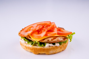 phased assembly of a hamburger on a light background1