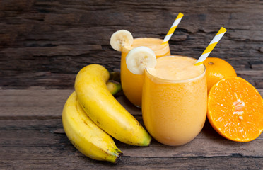 Banana and orange smoothies yellow colorful fruit juice milkshake blend beverage healthy high...