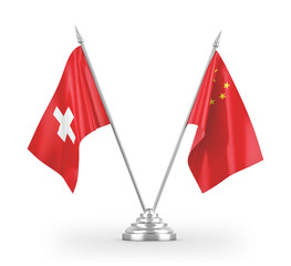 China and Switzerland table flags isolated on white 3D rendering