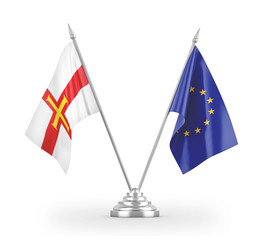 European Union and Guernsey table flags isolated on white 3D rendering