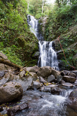 Fototapeta premium rappelling down a waterfall