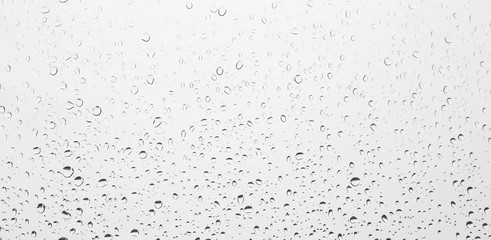 raindrops on white glass surface