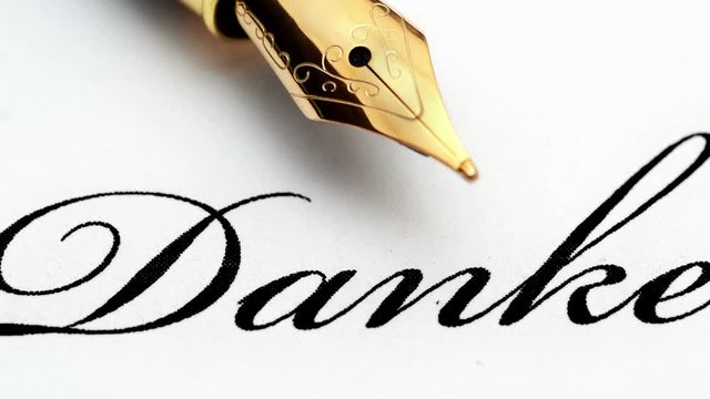 Close up of fountain pen on danke text
