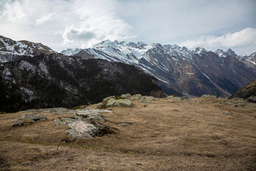 Overcast in mountains. Beautiful mountain rocks in clouds. Landscape of the North Caucasus